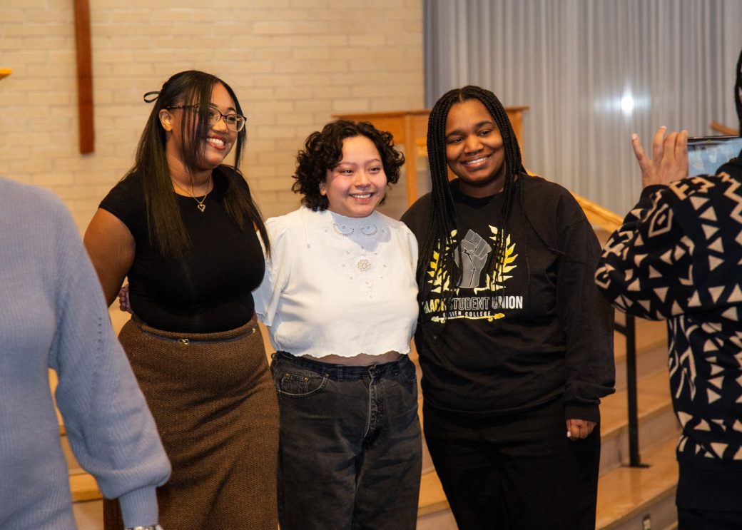 Three women hugging at King Celebration 2024