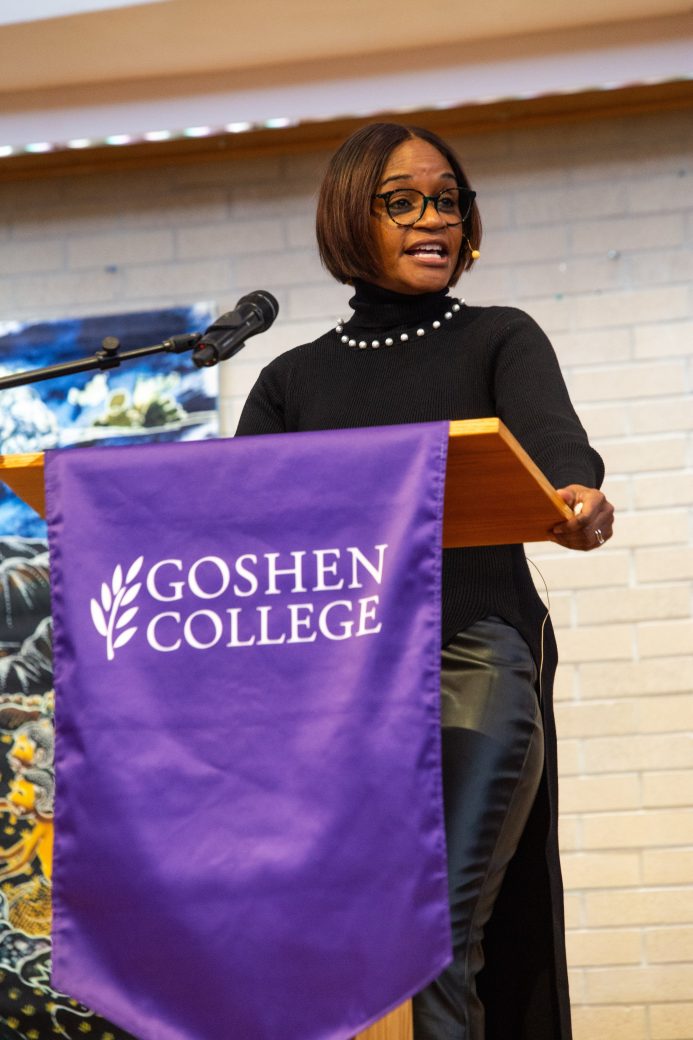 Woman doing a speech at stage's pulpit
