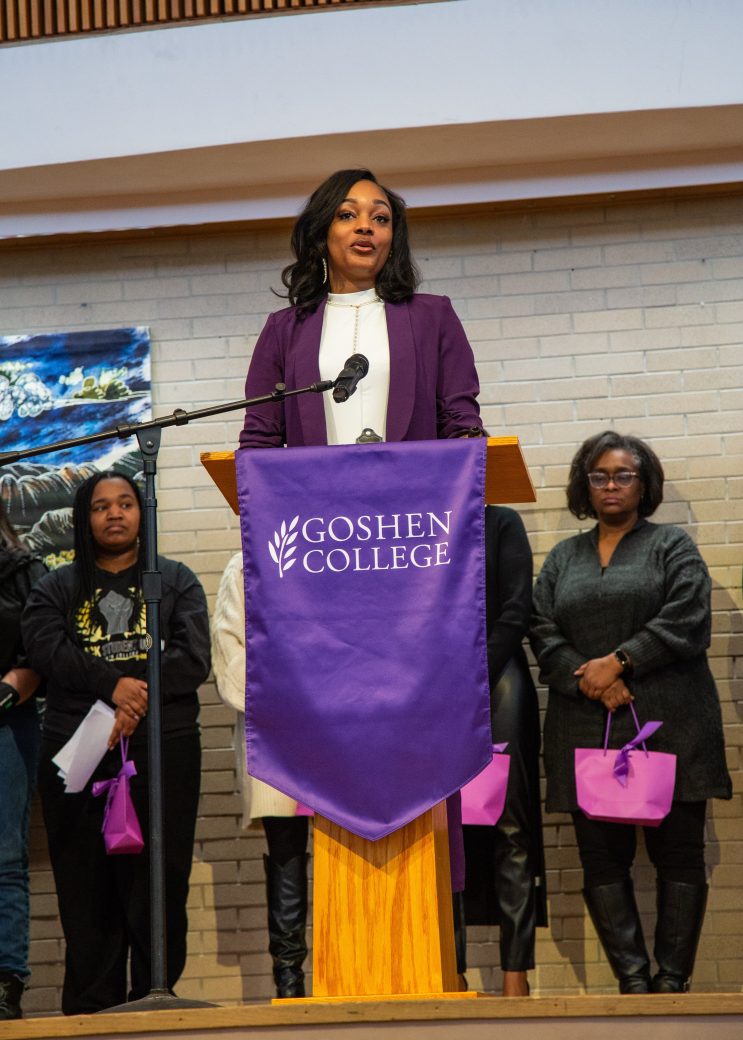 Woman doing a speech at stage's pulpit