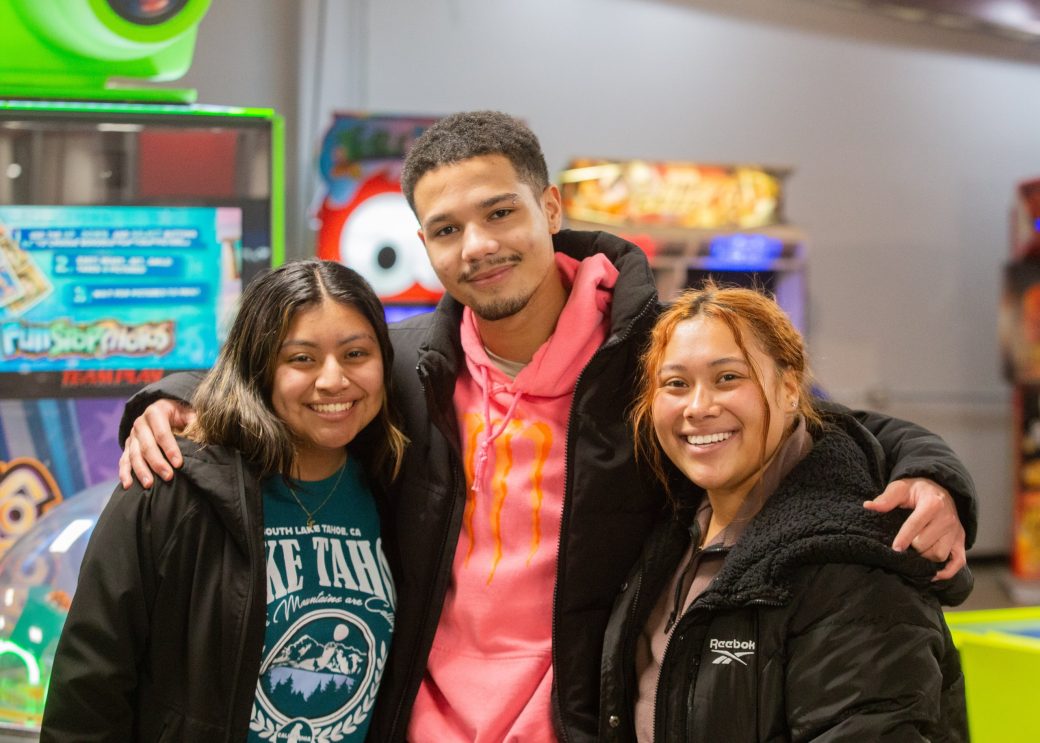 People hugging at bowling night
