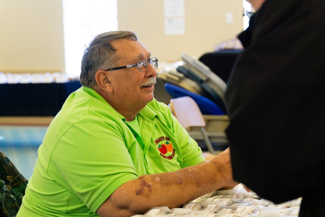 Man seated at Michiana Regional Seed Swap 2024