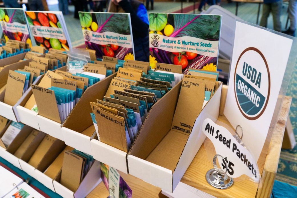 Packs of seed at at Michiana Regional Seed Swap 2024