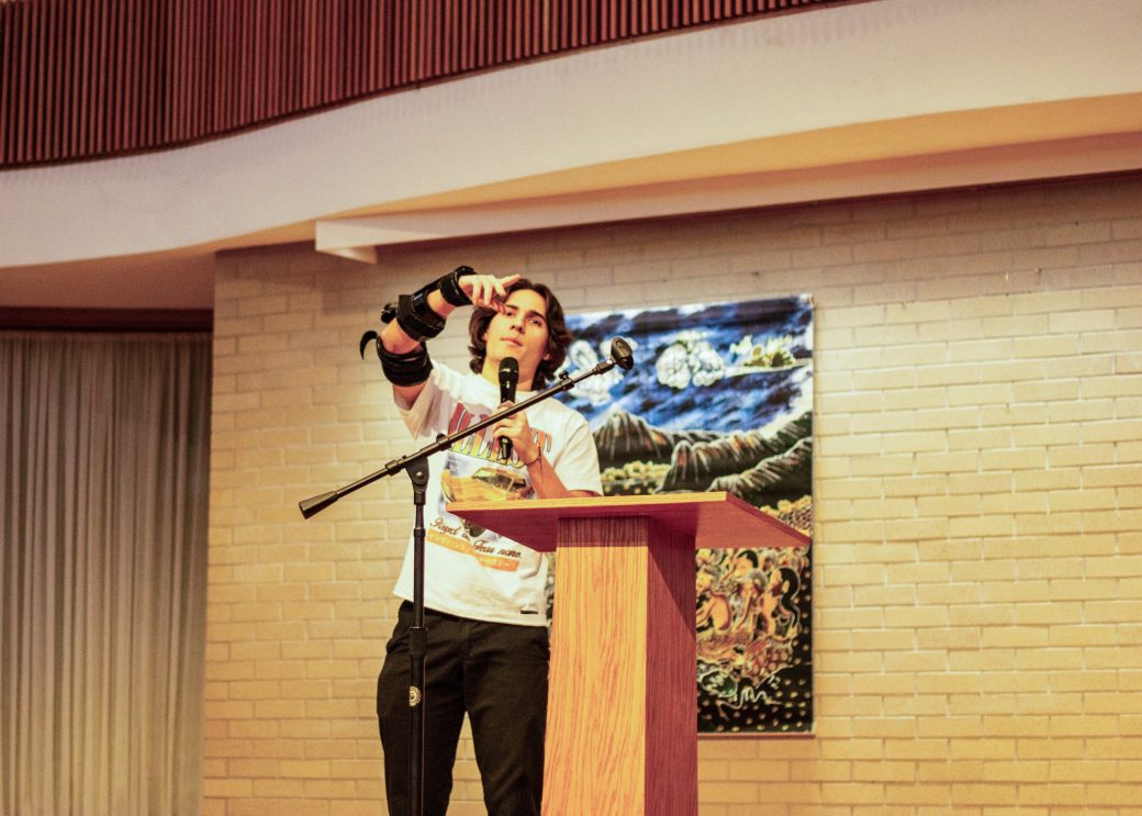 Woman doing a speech at stage's pulpit