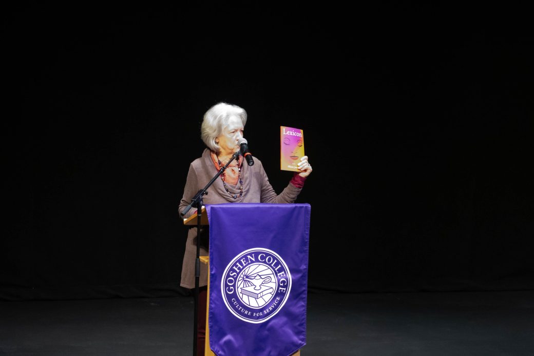 Woman with an image doing a speech at stage's pulpit at King Celebration 2024