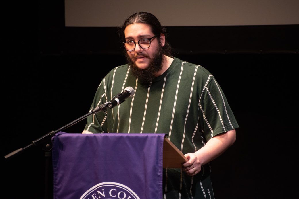 Man doing a speech at stage's pulpit