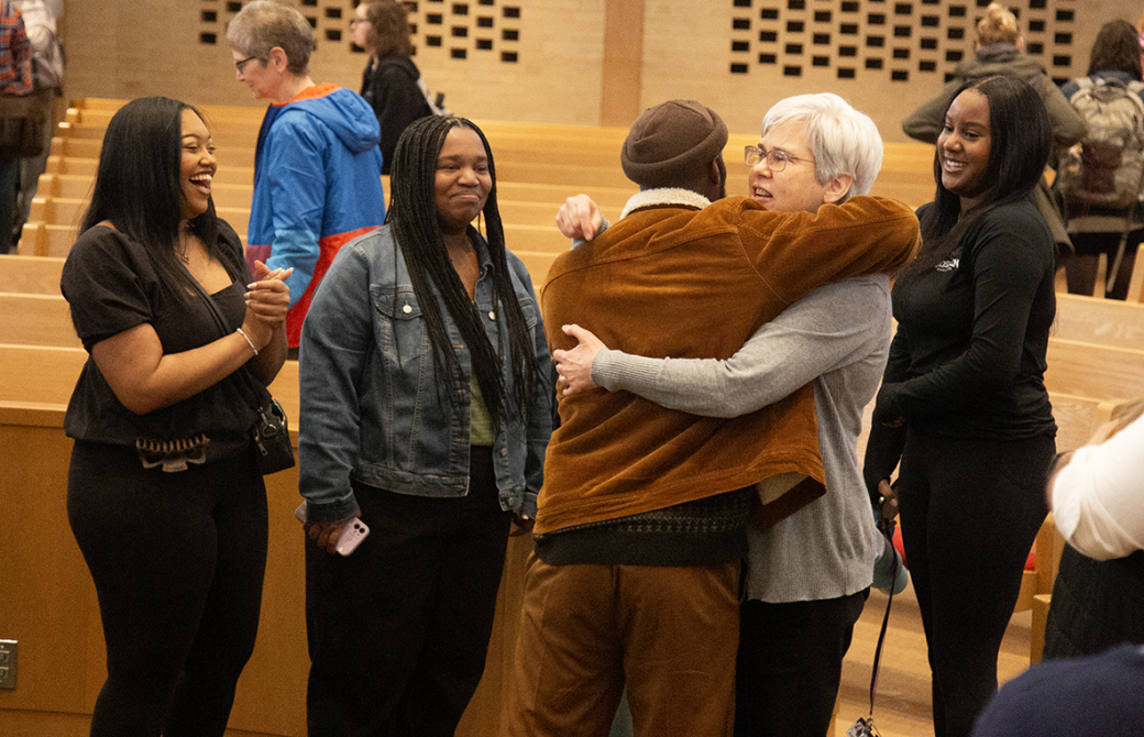 People hugging at Black History Month 2024