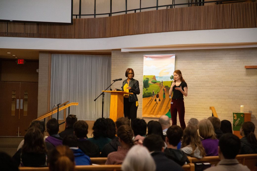 Woman doing a speech at Black History Month 2024
