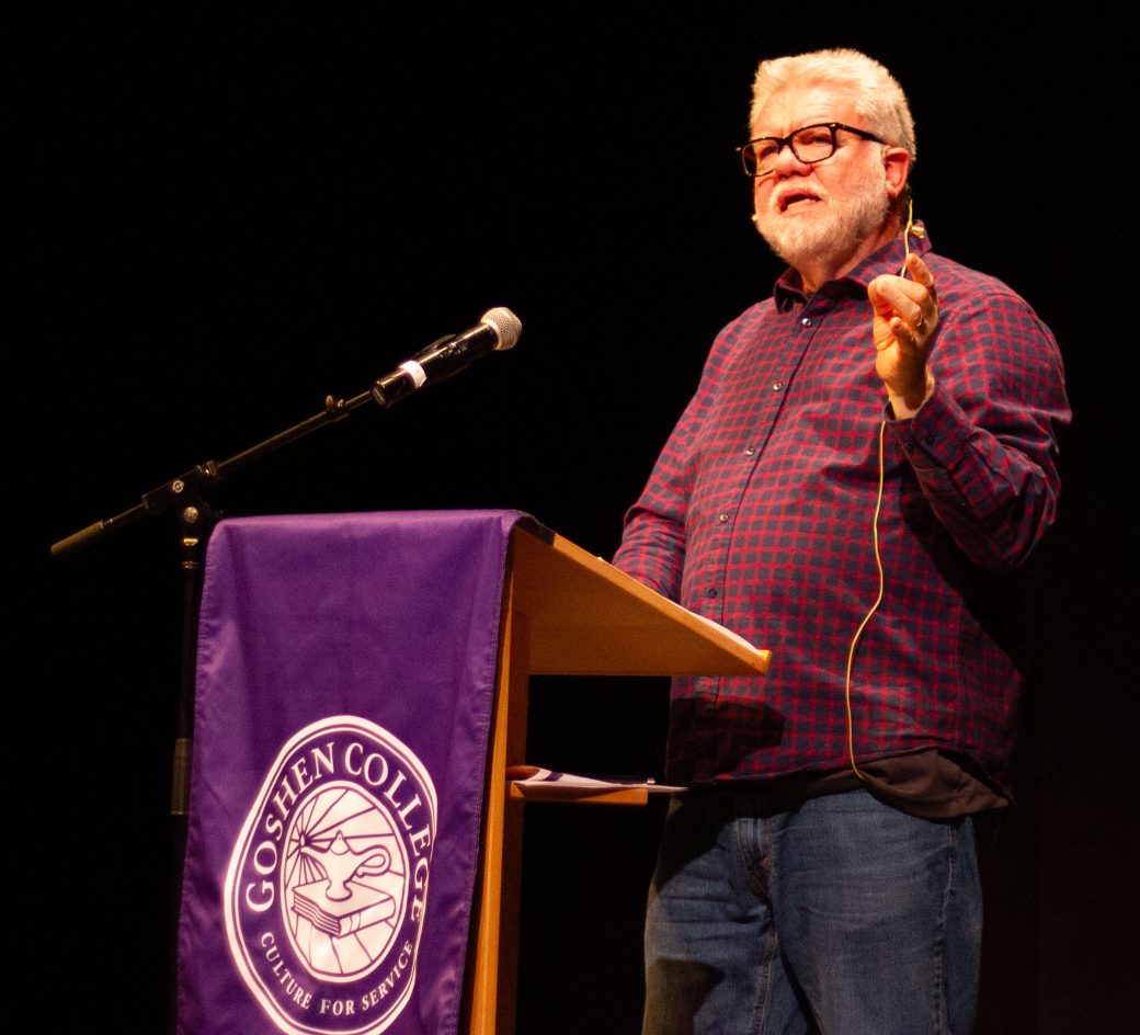 man speaking in a pulpit