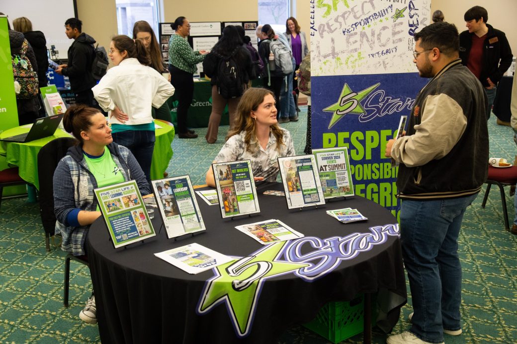 People talking at at Community Engagement Fair 2024