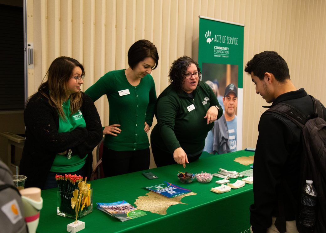People talking at at Community Engagement Fair 2024