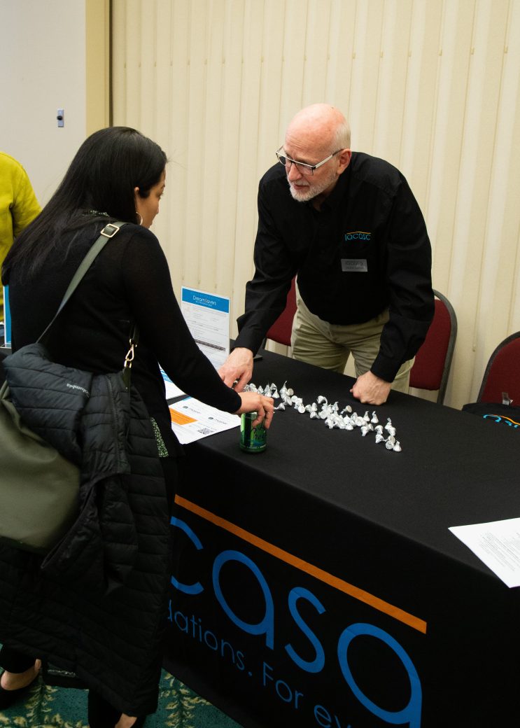 People talking at at Community Engagement Fair 2024