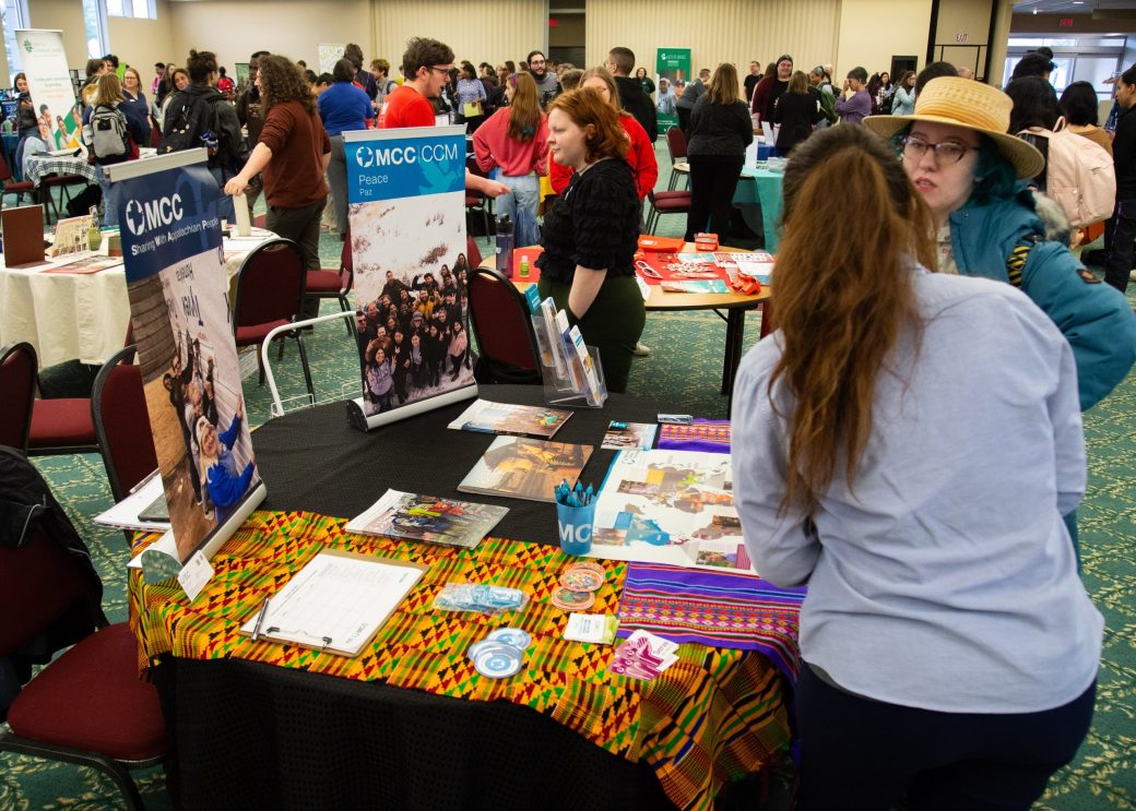 Two woman talking at Community Engagement Fair 2024
