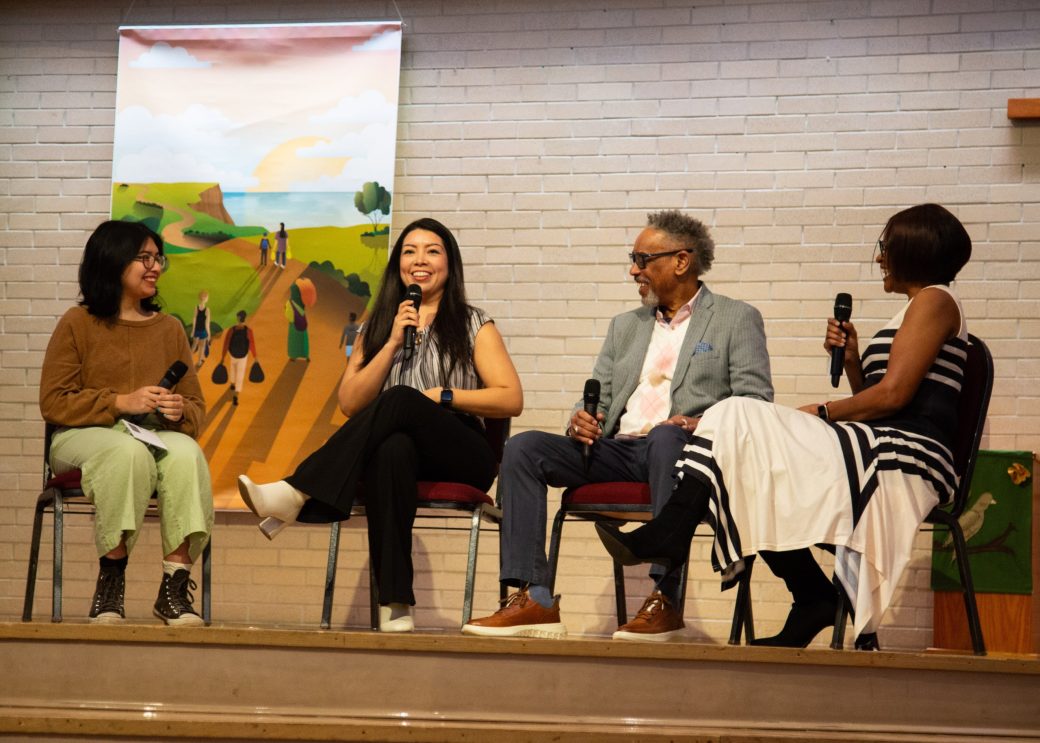 People talking on the stage at Community Engagement Fair 2024