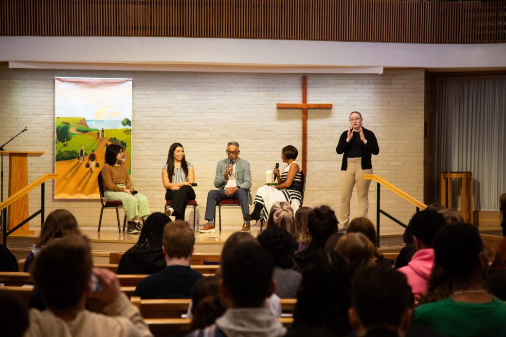 People talking on the stage at Community Engagement Fair 2024