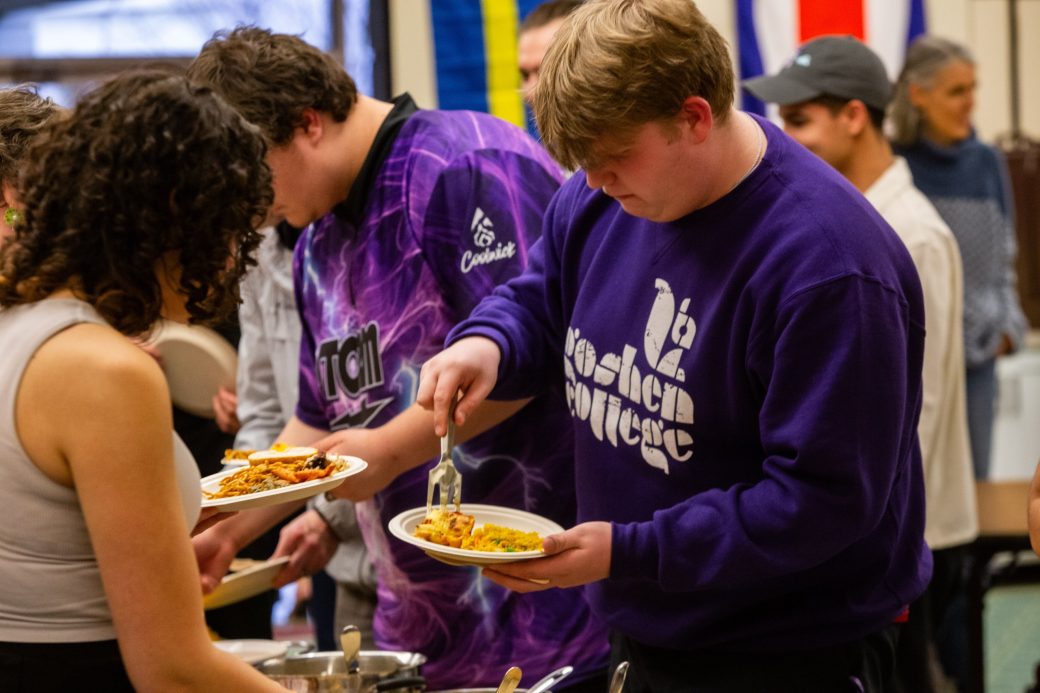 Goshen college students serving themselves with food