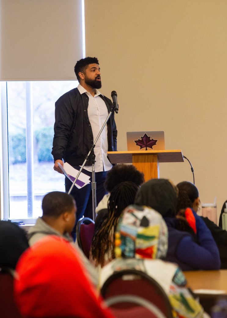 Man doing a speech at African American Spring Open House 2024