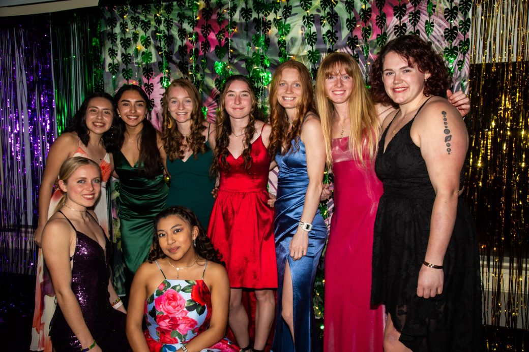 Women stricking a pose and smiling to the camera