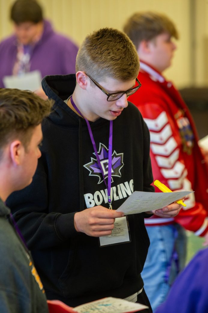 Goshen college student looking in a menu