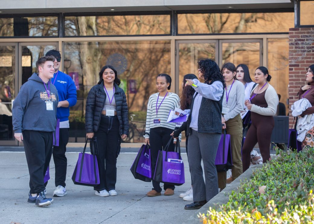Goshen colege students walking outside of the college