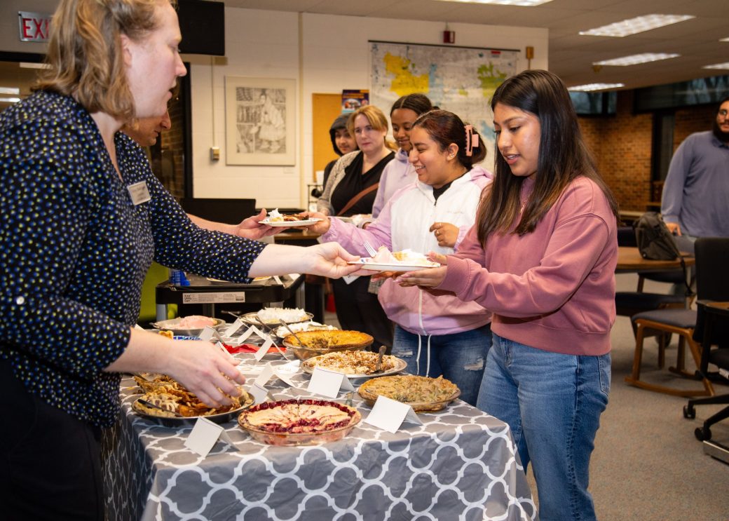 Woman serving a man at Goshen college