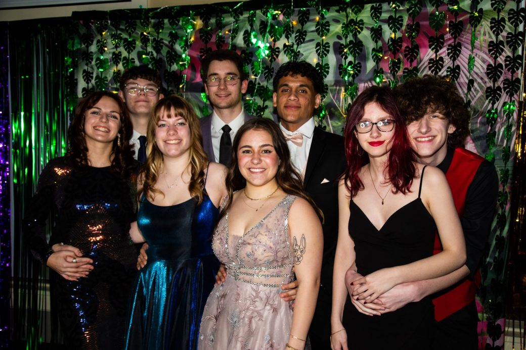 People strcking a pose and smiling to the camera