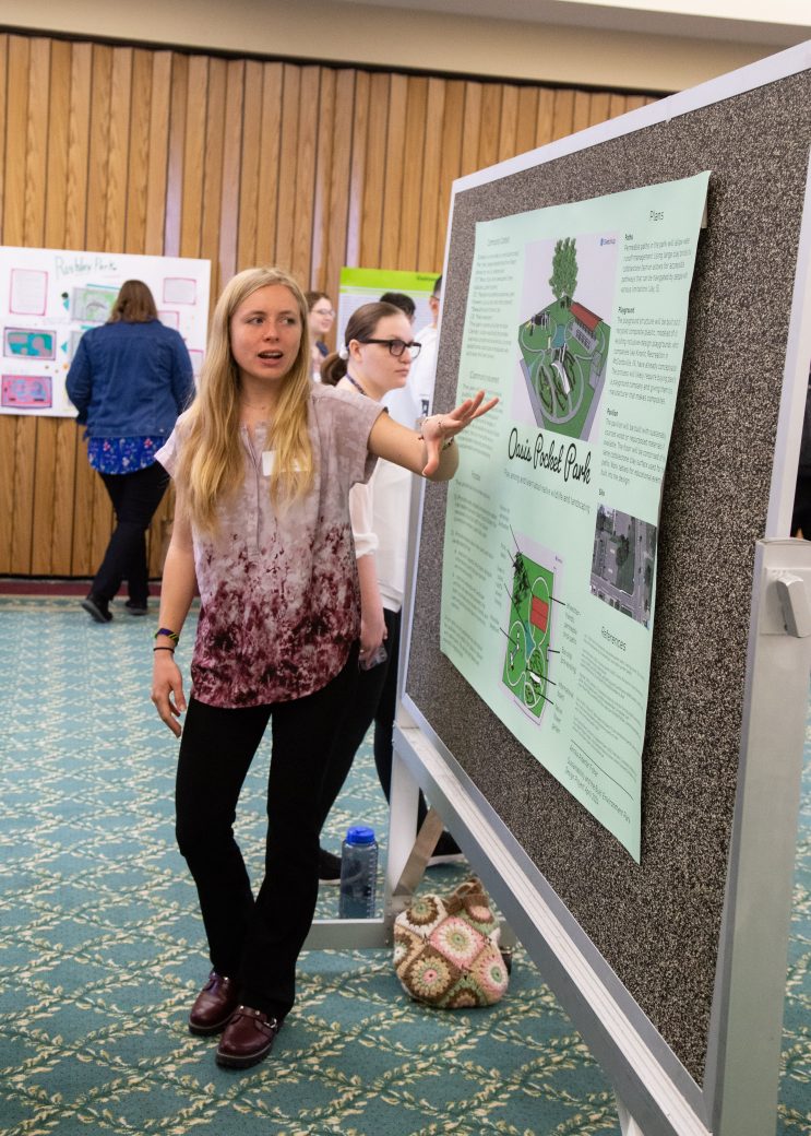 Woman explaining the things at the board