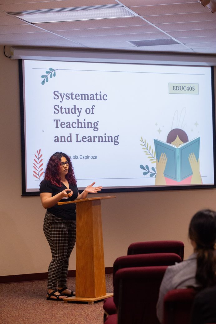 Woman doing a presentantion at Academic Symposium 2024