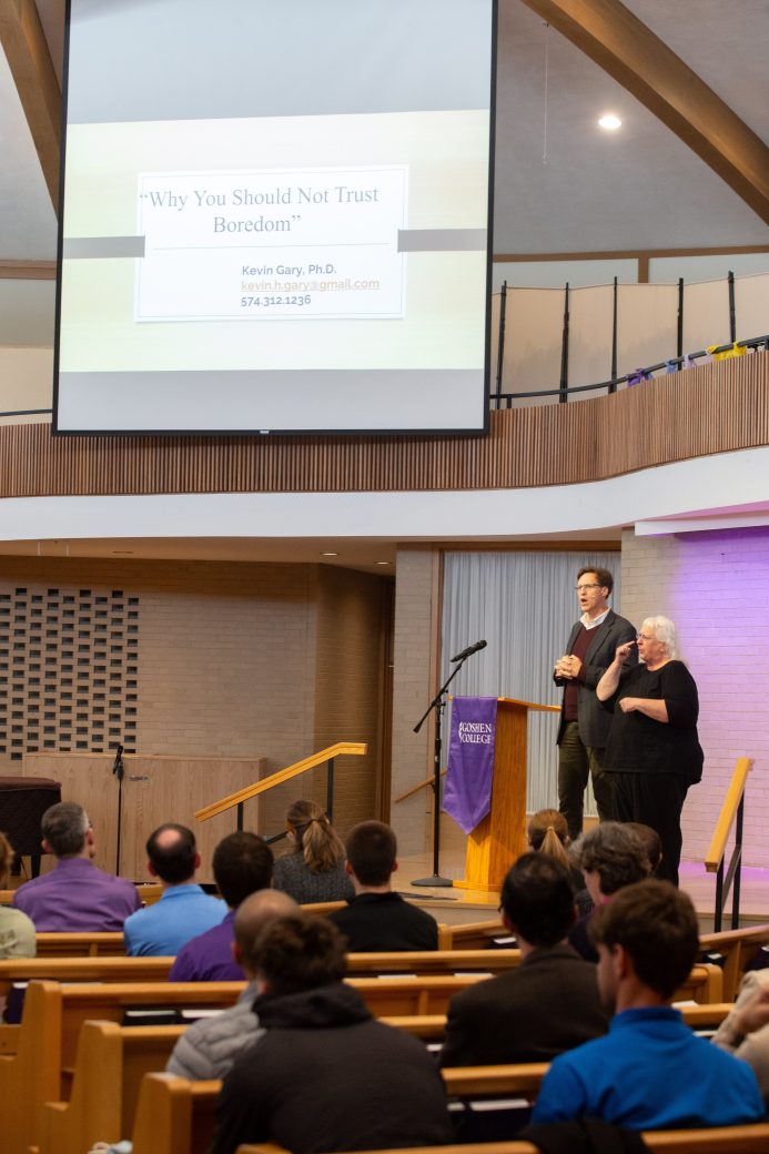 Two man doing a presentation at Academic Symposium 2024