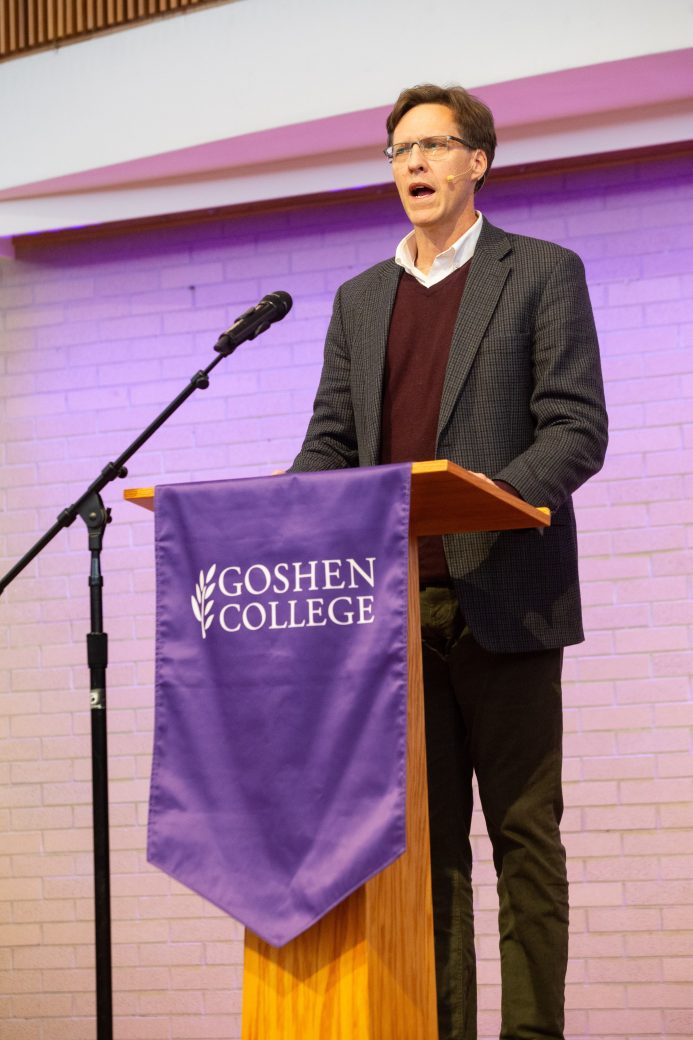 Man giving a speech at Academic Symposium 2024