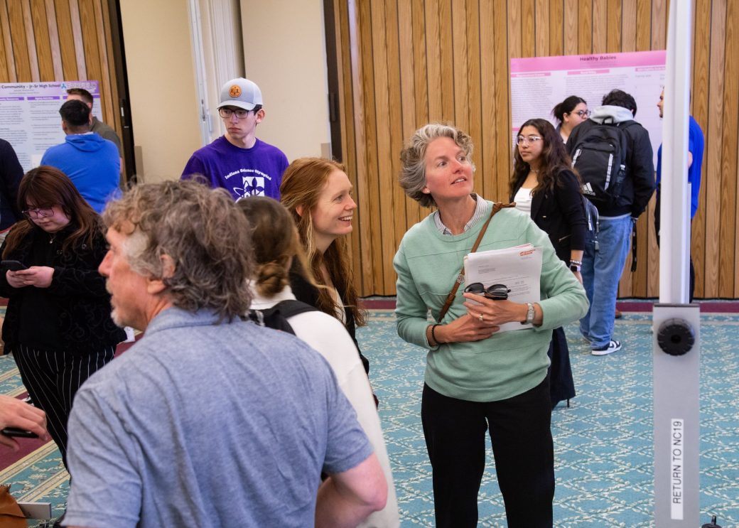 People talking at Academic Symposium 2024