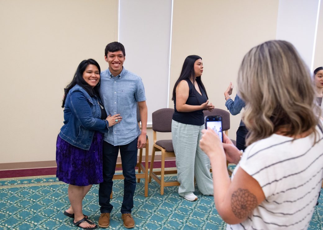 A man and a woman hugging at President's Graduating Leaders Awards 2024