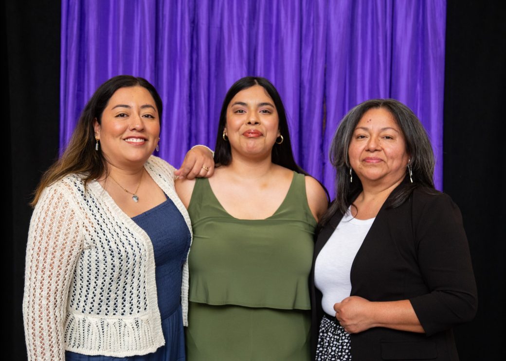 Three women hugging at President's Graduating Leaders Awards 2024