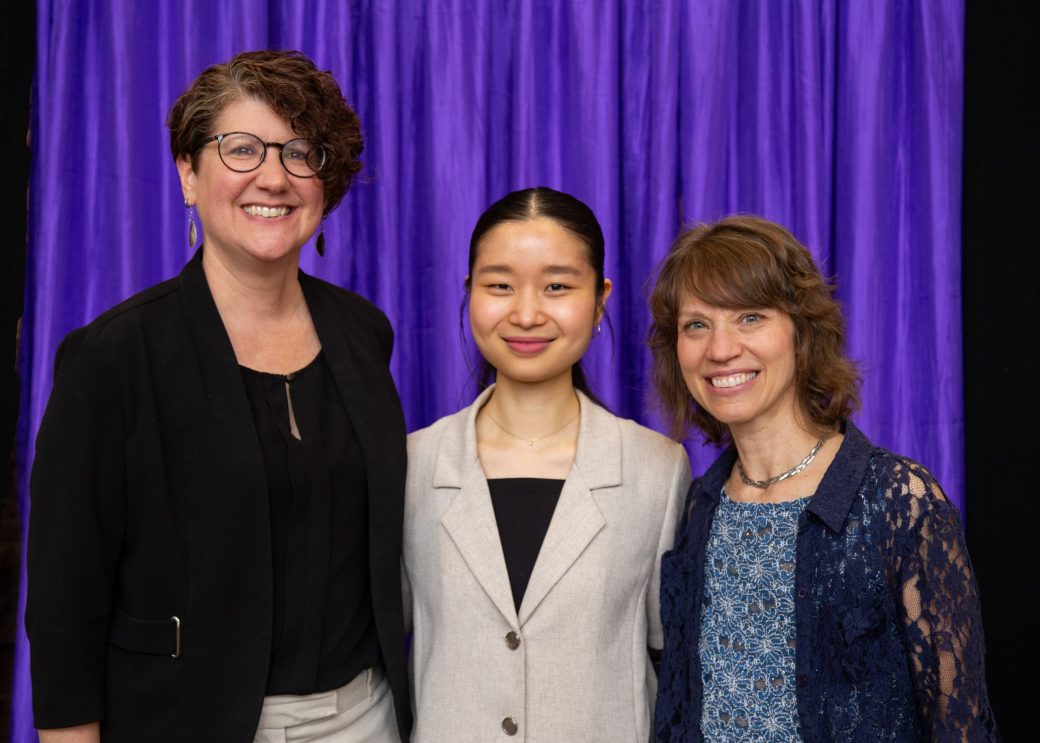 Three women hugging at President's Graduating Leaders Awards 2024