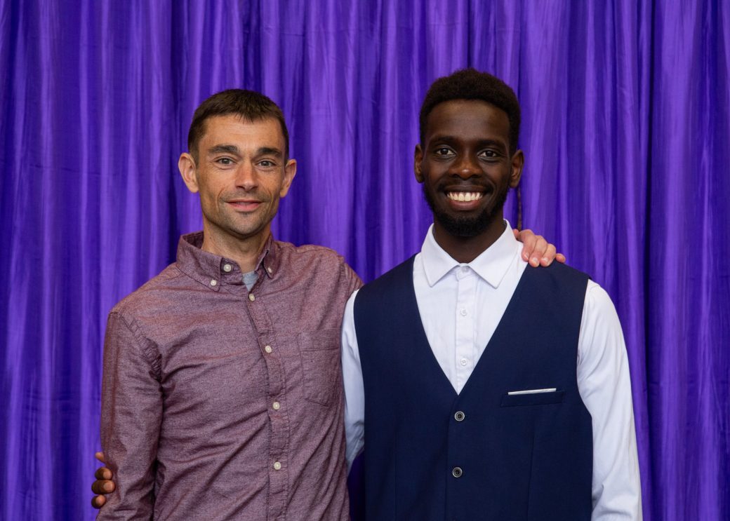 Two men hugging at President's Graduating Leaders Awards 2024