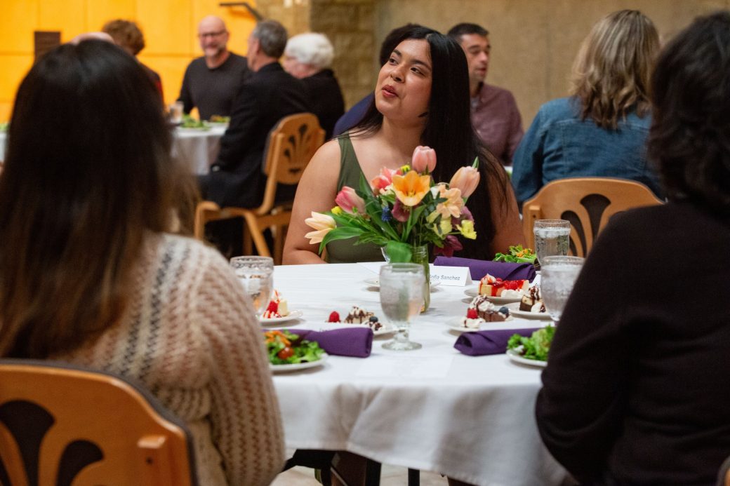 People seated talking at President's Graduating Leaders Awards 2024
