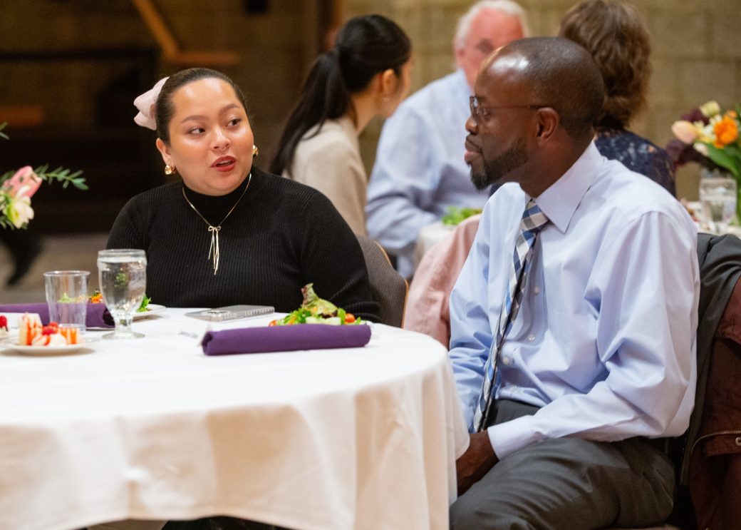 People seated talking at President's Graduating Leaders Awards 2024
