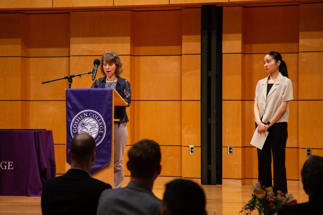 woman speaking at stage's pulpit at President's Graduating Leaders Awards 2024