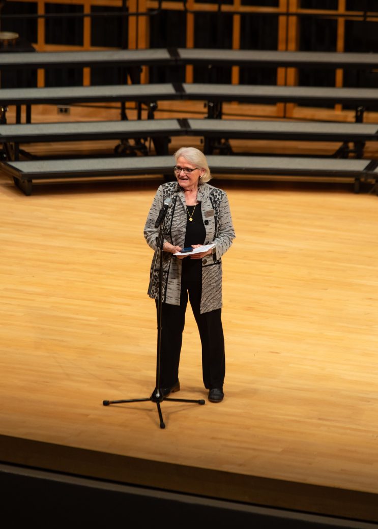 Woman speaking on the stage at Low Voice Festival 2024