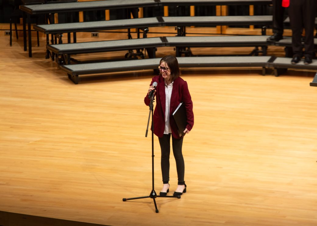 Woman speaking on the stage at Low Voice Festival 2024
