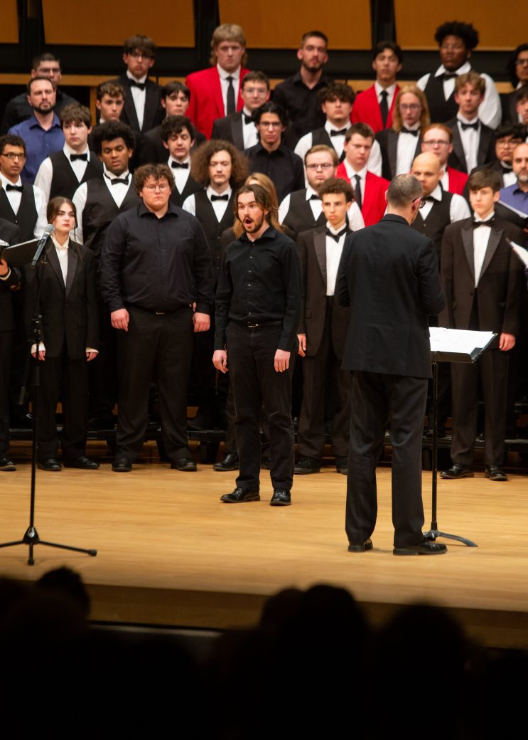 All music choirs singing together at low voice festival