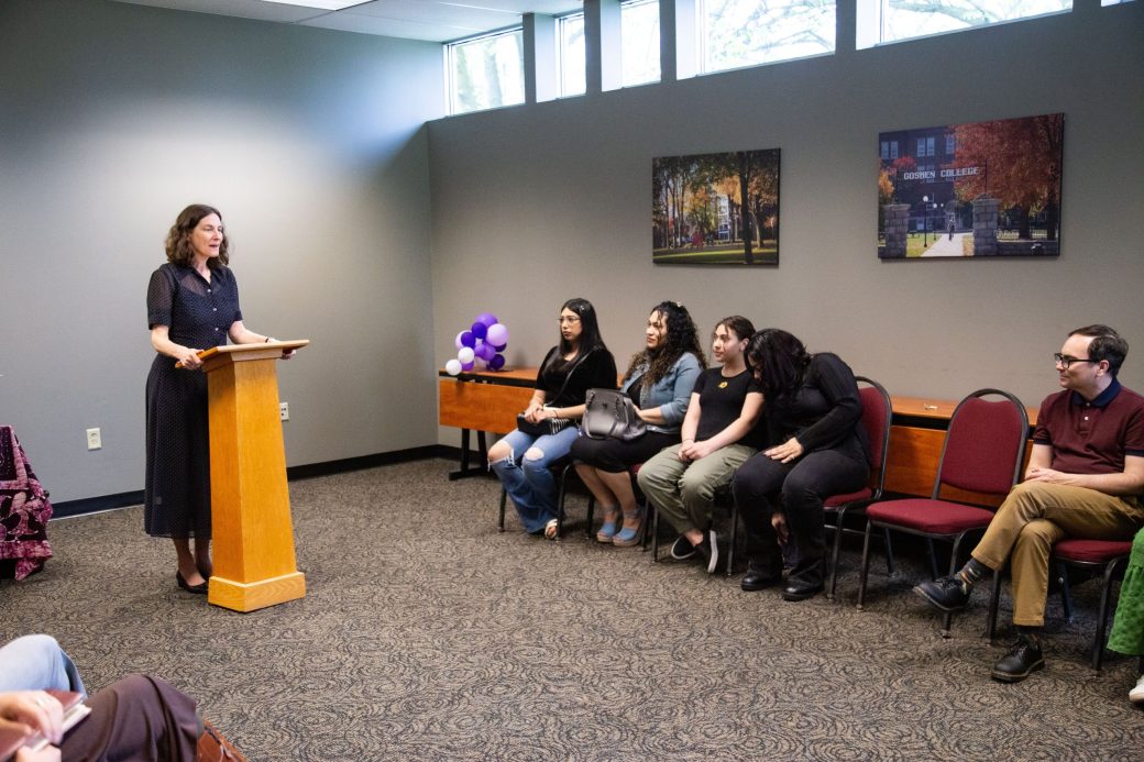 Woman speaking in a pulpit at Academic Department Receptions and Baccalaureate Celebration