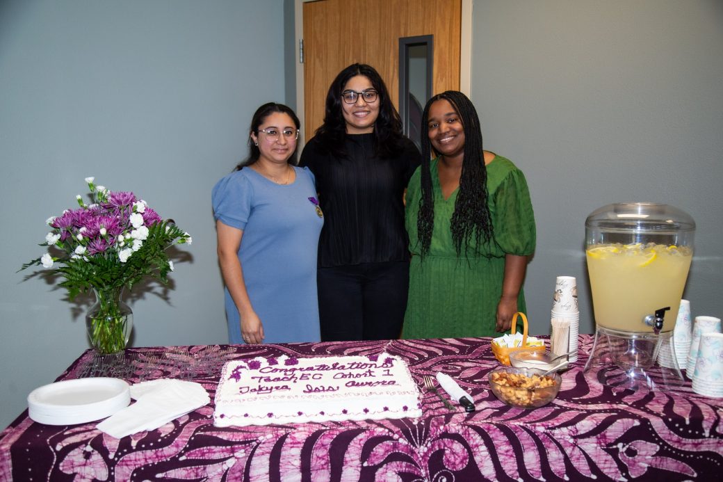 Three women hugging at Academic Department Receptions and Baccalaureate Celebration