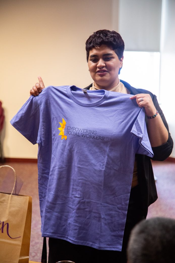 Woman with a purple t-shirt at Academic Department Receptions and Baccalaureate Celebration