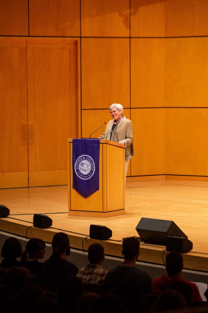 Woman doing a speech at the stage's pulpit