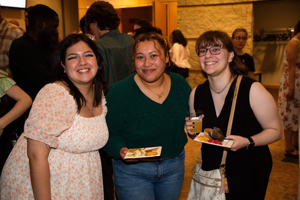 Three women hugging at Academic Department Receptions and Baccalaureate Celebration