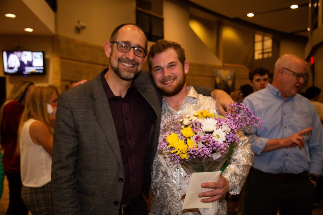 Two men hugging at Academic Department Receptions and Baccalaureate Celebration