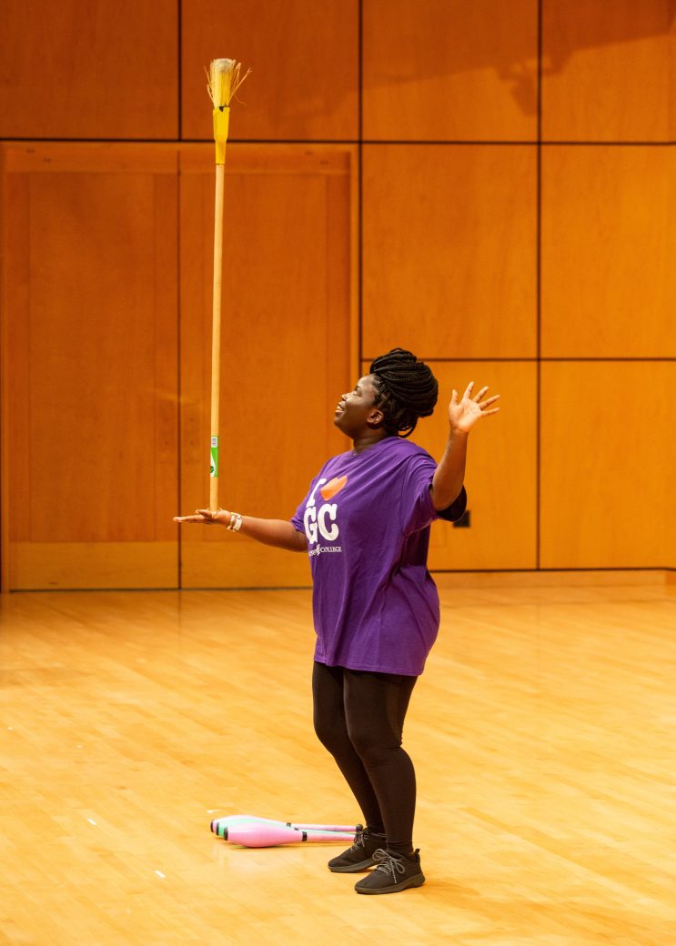 Woman doing a juggle on the stage at Academic Department Receptions and Baccalaureate Celebration