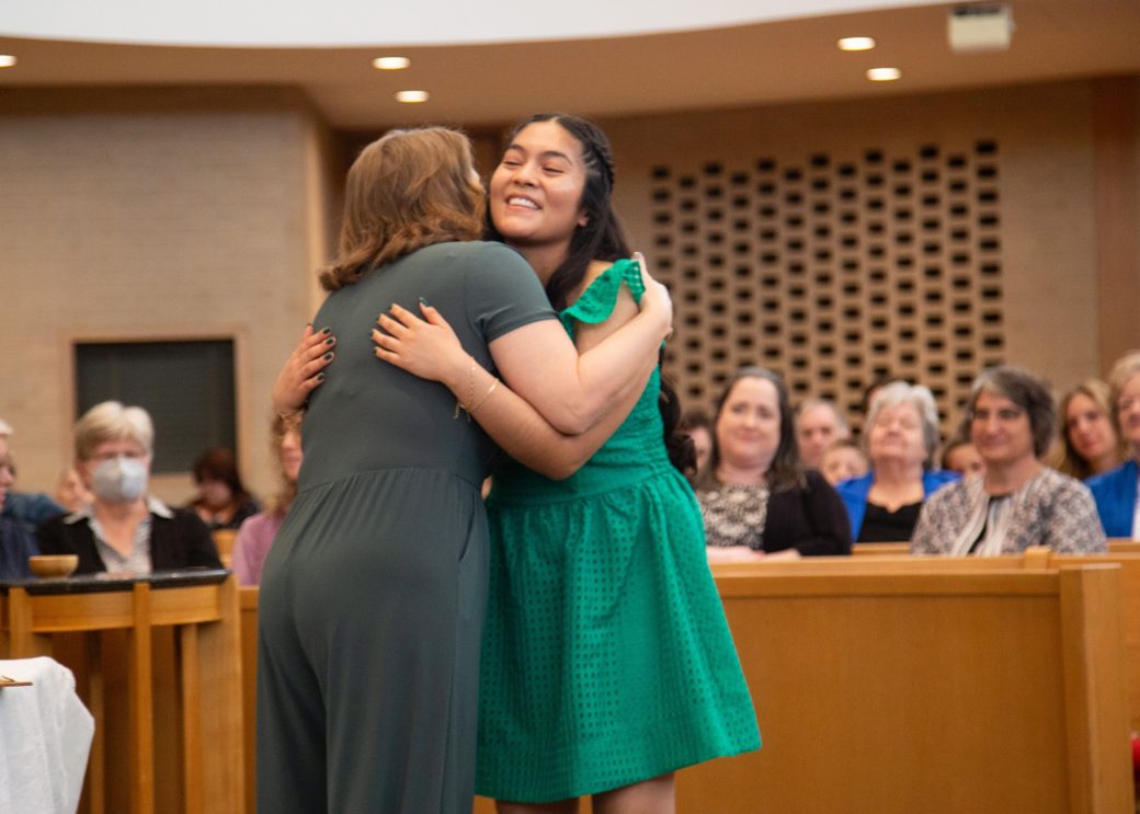 Two women hugging at Commencement 2024: Nurses' Pinning Ceremony