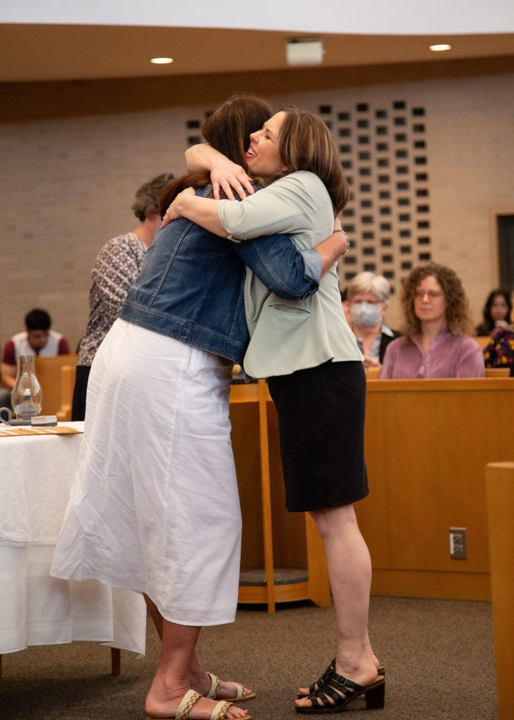 Two women hugging at Commencement 2024: Nurses' Pinning Ceremony