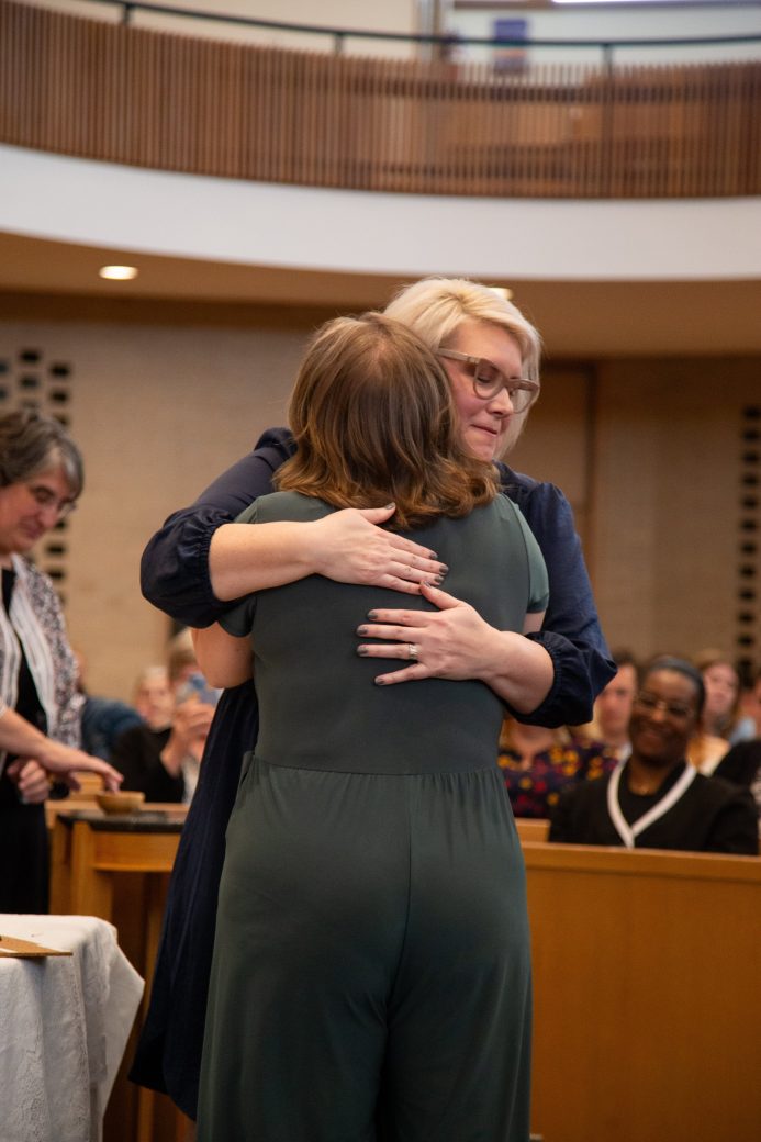 Two women hugging at Commencement 2024: Nurses' Pinning Ceremony